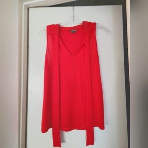 Sleeveless red blouse